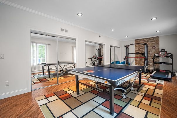 Fitness Equipment, Game Room, Interior, Recessed Lighting, Stone Walls, Wood Texture Flooring