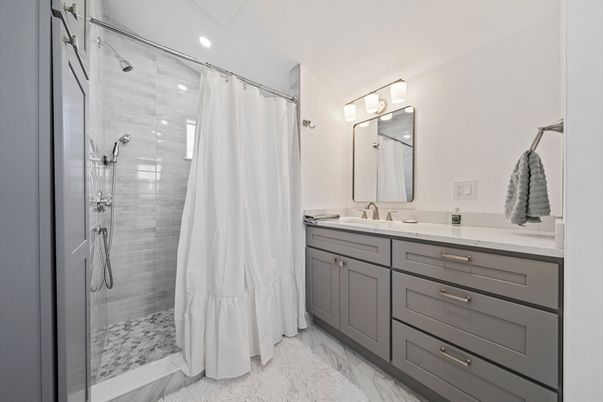 Bathroom, Dual Sink Vanities, Glass Shower, Interior, Marble, Recessed Lighting