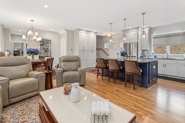 Chandelier, Dining room, Interior, Kitchen, Living room, Pendant Lights, Recessed Lighting, Stainless Steel Appliances, Wood Texture Flooring