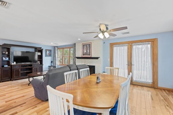 Dining room, Fireplace, Interior, Living room, Recessed Lighting, Wood Texture Flooring