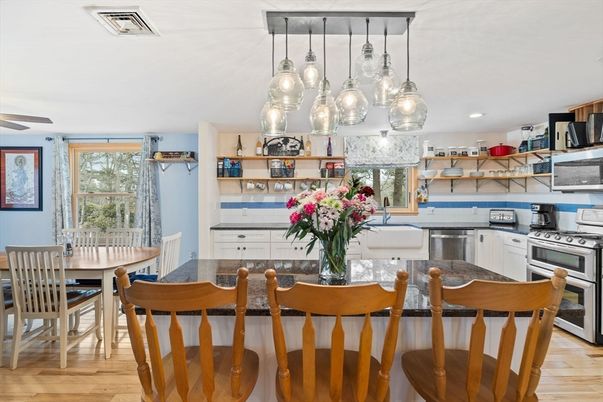 Dining room, Interior, Kitchen, Pendant Lights, Recessed Lighting, Stainless Steel Appliances, Wood Texture Flooring