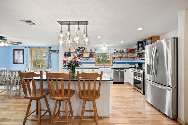 Dining room, Interior, Kitchen, Pendant Lights, Recessed Lighting, Stainless Steel Appliances, Wood Texture Flooring