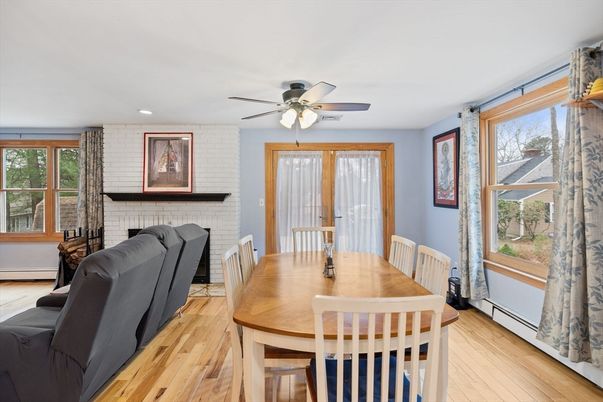 Dining room, Fireplace, Interior, Recessed Lighting, Stone Walls, Wood Texture Flooring