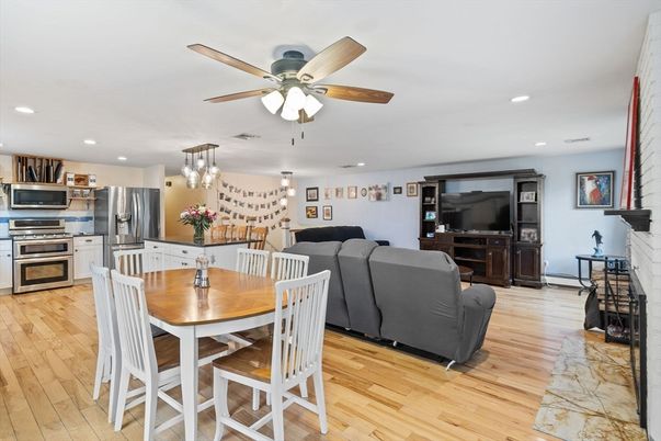 Dining room, Fireplace, Interior, Kitchen, Living room, Pendant Lights, Recessed Lighting, Stainless Steel Appliances, Wood Texture Flooring