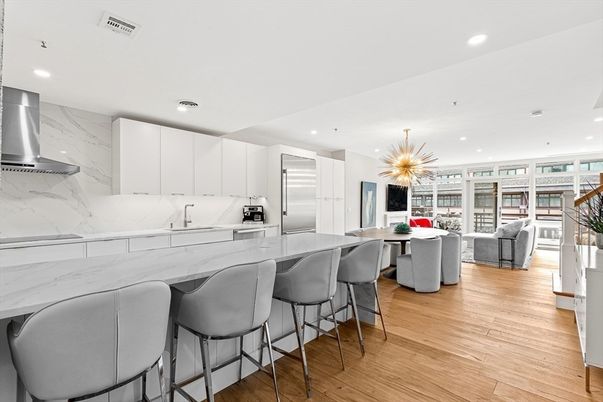 Dining room, Interior, Kitchen, Living room, Marble Walls, Pendant Lights, Recessed Lighting, Stainless Steel Appliances, Wood Texture Flooring