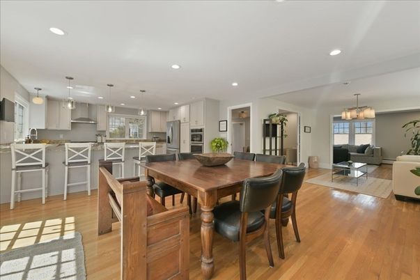 Chandelier, Dining room, Interior, Kitchen, Living room, Pendant Lights, Recessed Lighting, Stainless Steel Appliances, Wood Texture Flooring
