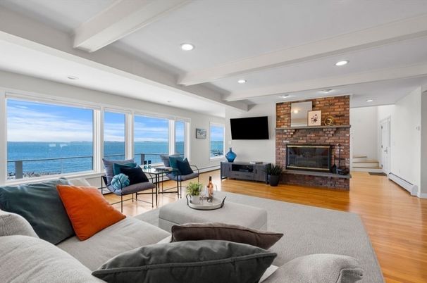 Fireplace, Interior, Living room, Recessed Lighting, Stone Walls, Water, Wood Texture Flooring