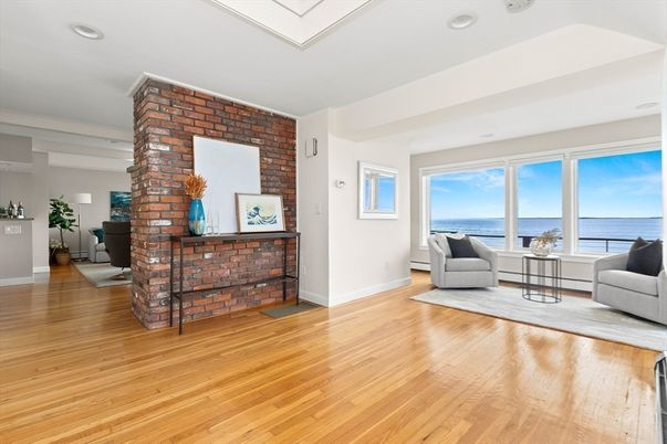 Fireplace, Interior, Living room, Recessed Lighting, Stone Walls, Water, Wood Texture Flooring