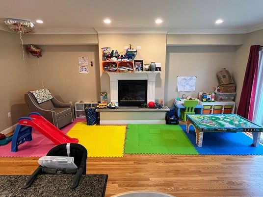 Fireplace, Game Room, Interior, Recessed Lighting, Wood Texture Flooring