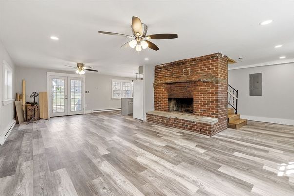Empty room, Fireplace, Interior, Recessed Lighting, Stone Walls, Wood Texture Flooring
