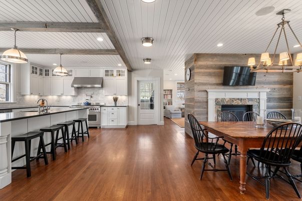 Dining room, Fireplace, Interior, Kitchen, Pendant Lights, Recessed Lighting, Stainless Steel Appliances, Wood Texture Flooring
