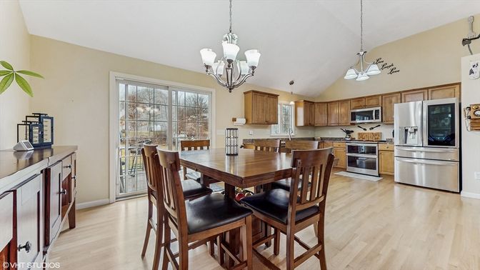 Chandelier, Dining room, Interior, Kitchen, Pendant Lights, Stainless Steel Appliances, Wood Texture Flooring