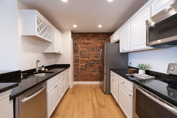 Interior, Kitchen, Recessed Lighting, Stainless Steel Appliances, Stone Walls, Wood Texture Flooring