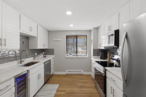 Interior, Kitchen, Recessed Lighting, Stainless Steel Appliances, Wood Texture Flooring