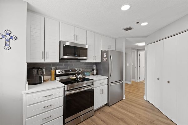 Interior, Kitchen, Recessed Lighting, Stainless Steel Appliances, Wood Texture Flooring