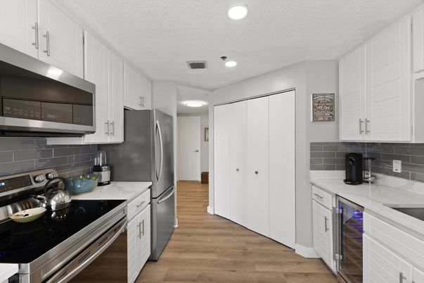 Interior, Kitchen, Recessed Lighting, Stainless Steel Appliances, Wood Texture Flooring