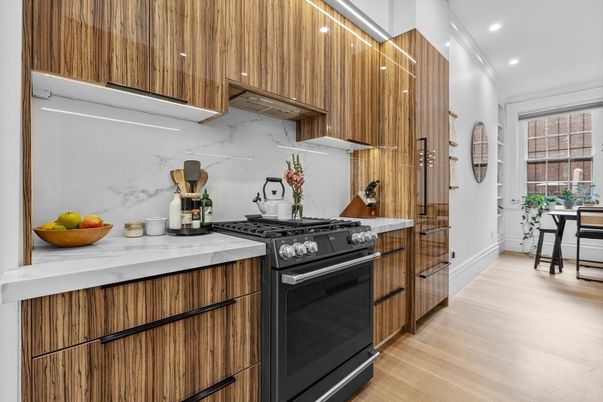 Interior, Kitchen, Marble Walls, Recessed Lighting, Stainless Steel Appliances, Wood Texture Flooring