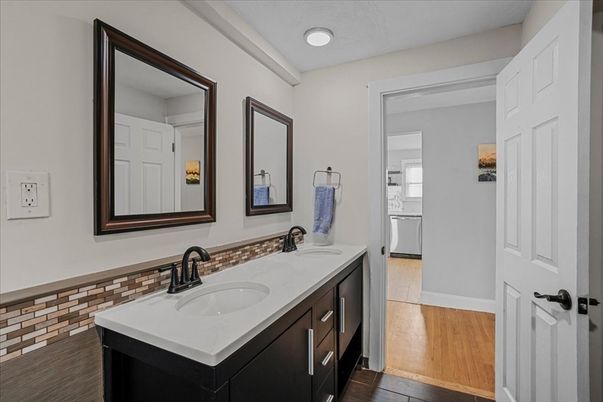 Bathroom, Dual Sink Vanities, Interior, Recessed Lighting, Wood Texture Flooring