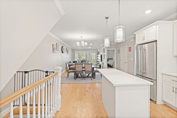 Chandelier, Dining room, Interior, Kitchen, Pendant Lights, Recessed Lighting, Stainless Steel Appliances, Wood Texture Flooring