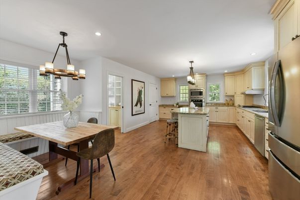 Chandelier, Dining room, Interior, Kitchen, Pendant Lights, Recessed Lighting, Stainless Steel Appliances, Wood Texture Flooring