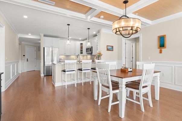 Chandelier, Dining room, Interior, Kitchen, Pendant Lights, Recessed Lighting, Stainless Steel Appliances, Wooden Ceilings, Wood Texture Flooring