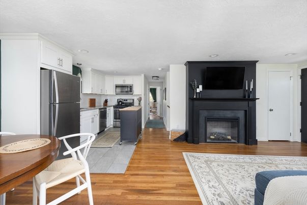 Fireplace, Interior, Kitchen, Stainless Steel Appliances, Wood Texture Flooring
