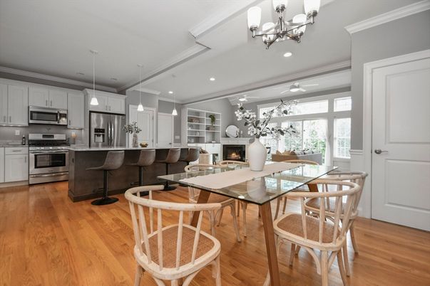 Chandelier, Dining room, Fireplace, Interior, Kitchen, Living room, Pendant Lights, Recessed Lighting, Stainless Steel Appliances, Wood Texture Flooring