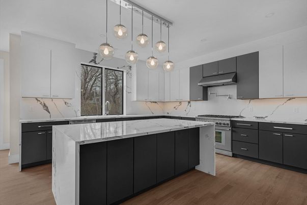 Interior, Kitchen, Marble Walls, Pendant Lights, Stainless Steel Appliances, Wood Texture Flooring