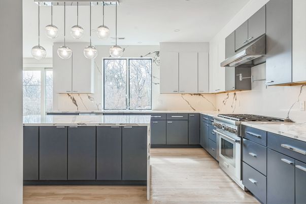 Interior, Kitchen, Marble Walls, Pendant Lights, Recessed Lighting, Stainless Steel Appliances, Wood Texture Flooring