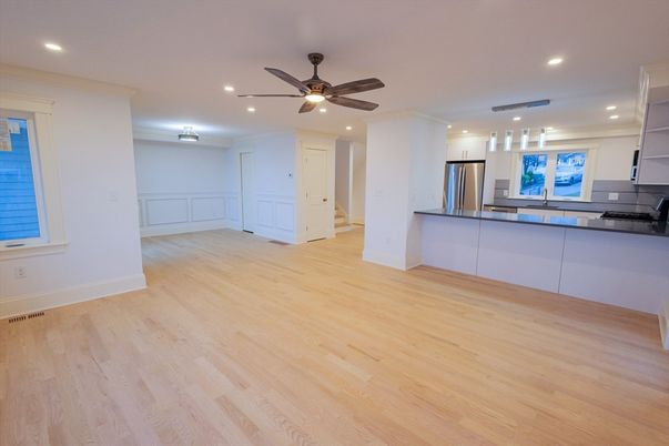 Empty room, Interior, Kitchen, Recessed Lighting, Stainless Steel Appliances, Wood Texture Flooring