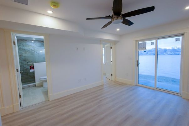 Bathroom, Empty room, Interior, Marble Walls, Recessed Lighting, Wood Texture Flooring