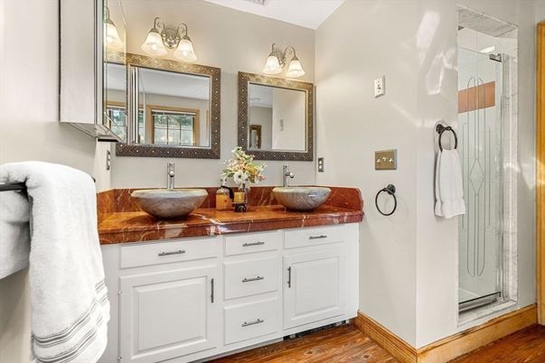 Bathroom, Dual Sink Vanities, Glass Shower, Interior, Tile Countertops, Wood Texture Flooring