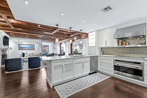 Fireplace, Interior, Kitchen, Living room, Pendant Lights, Recessed Lighting, Stainless Steel Appliances, Wooden Beams, Wooden Ceilings, Wood Texture Flooring