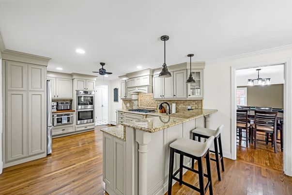 Dining room, Interior, Kitchen, Pendant Lights, Recessed Lighting, Stainless Steel Appliances, Wood Texture Flooring