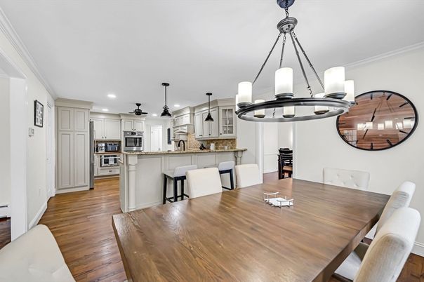 Dining room, Interior, Kitchen, Pendant Lights, Recessed Lighting, Stainless Steel Appliances, Wood Texture Flooring