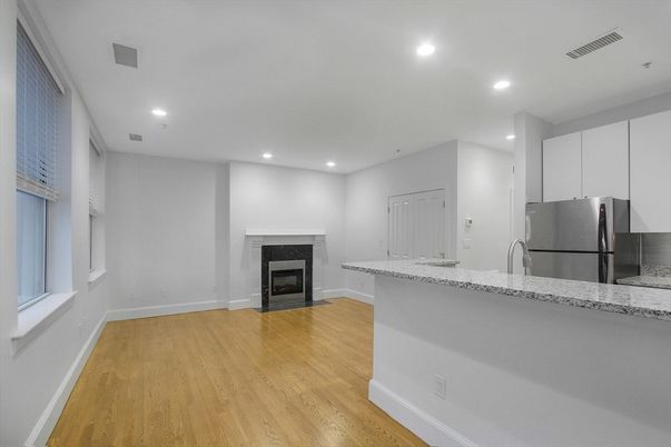 Fireplace, Interior, Kitchen, Recessed Lighting, Stainless Steel Appliances, Wood Texture Flooring