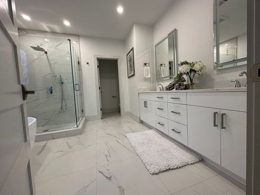 Bathroom, Dual Sink Vanities, Glass Shower, Interior, Marble, Marble Walls, Recessed Lighting