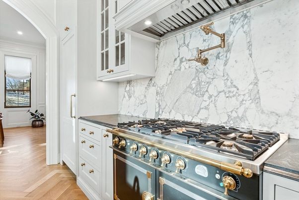 Interior, Kitchen, Marble Walls, Recessed Lighting, Stainless Steel Appliances, Wood Texture Flooring