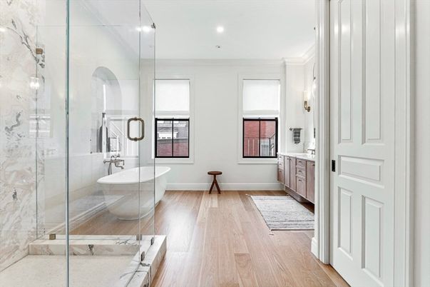 Bathroom, Free Standing Baths, Glass Shower, Interior, Marble Walls, Recessed Lighting, Wood Texture Flooring