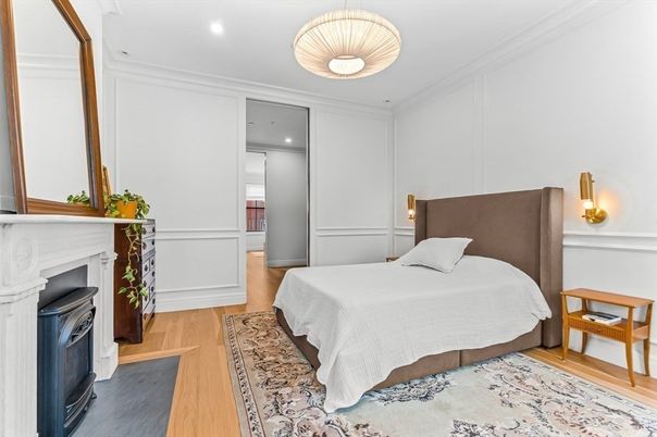 Bedroom, Fireplace, Interior, Pendant Lights, Recessed Lighting, Wood Texture Flooring
