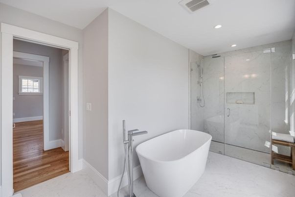 Bathroom, Free Standing Baths, Glass Shower, Interior, Marble, Marble Walls, Recessed Lighting, Wood Texture Flooring