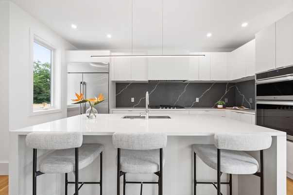 Interior, Kitchen, Marble Walls, Pendant Lights, Recessed Lighting, Stainless Steel Appliances, Wood Texture Flooring