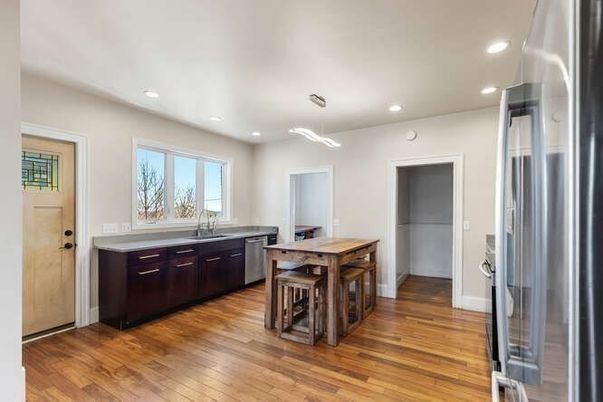 Dining room, Interior, Kitchen, Pendant Lights, Recessed Lighting, Stainless Steel Appliances, Wood Texture Flooring
