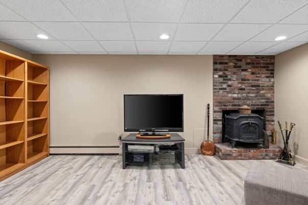 Fireplace, Interior, Recessed Lighting, Stone Walls, Wood Texture Flooring