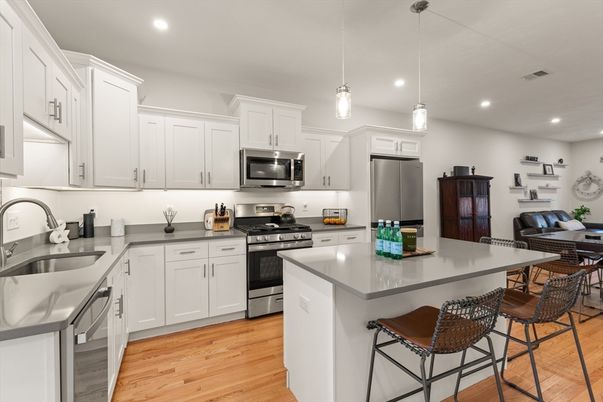 Interior, Kitchen, Pendant Lights, Recessed Lighting, Stainless Steel Appliances, Wood Texture Flooring