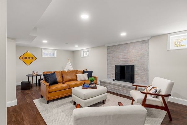 Fireplace, Interior, Living room, Recessed Lighting, Stone Walls, Wood Texture Flooring
