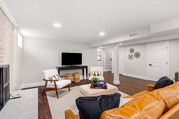 Fireplace, Interior, Living room, Recessed Lighting, Stone Walls, Wood Texture Flooring