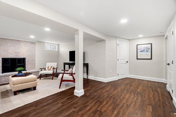 Fireplace, Interior, Living room, Recessed Lighting, Stone Walls, Wood Texture Flooring