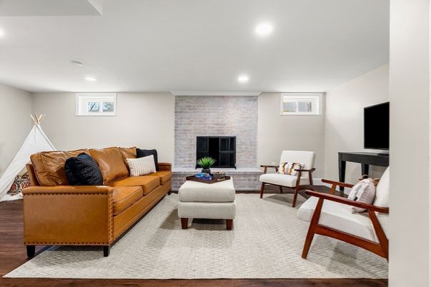 Fireplace, Interior, Living room, Recessed Lighting, Stone Walls, Wood Texture Flooring