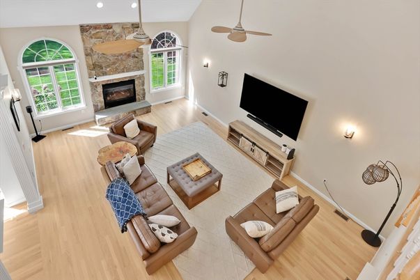 Fireplace, Interior, Living room, Recessed Lighting, Stone Walls, Wood Texture Flooring